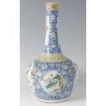 A 19th century Chinese bottle vase, enamel decorated with figure landscape reserves within a blue
