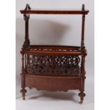 A Victorian figured walnut canterbury whatnot, the upper section raised on lyre type end supports,