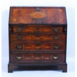 A George III mahogany and marquetry inlaid slopefront writing bureau, the sloping fall with