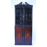 A late George III mahogany bookcase cabinet, the upper section having twin astragal glazed doors
