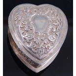 A modern silver heart shaped snuff box, the hinged lid with repousse decoration and vacant