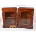 A pair of Victorian walnut marquetry inlaid and gilt metal mounted pier cabinets, each having a