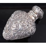 A Victorian silver scent bottle, the whole relief decorated with flowers and scrolls and having
