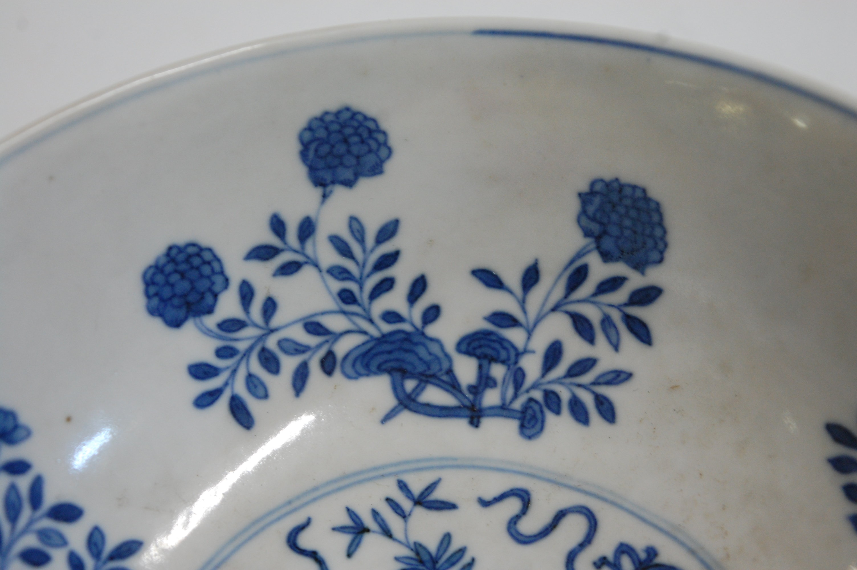 A Chinese porcelain bowl , the interior blue and white decorated with flowering rockwork and - Image 19 of 37