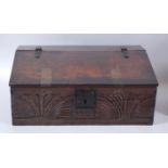 A circa 1700 and later joined oak bible box, the sloping fall with iron strapwork handles and