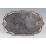 A 19th century French silver tray, of shaped rectangular form, having all-over floral engraved and