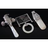 A small George V silver baby's rattle, modelled as Mr Punch, with mother of pearl teether, maker