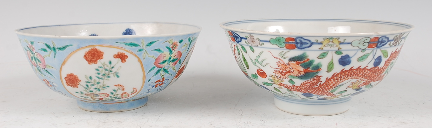 A Chinese porcelain bowl , the interior blue and white decorated with flowering rockwork and