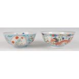 A Chinese porcelain bowl , the interior blue and white decorated with flowering rockwork and