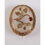 A late Victorian yellow metal and oval chalcedony brooch, having a translucent chalcedony panel with