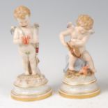 A pair of circa 1900 Meissen porcelain figures of Cupids, one with bellows lighting a fire incised