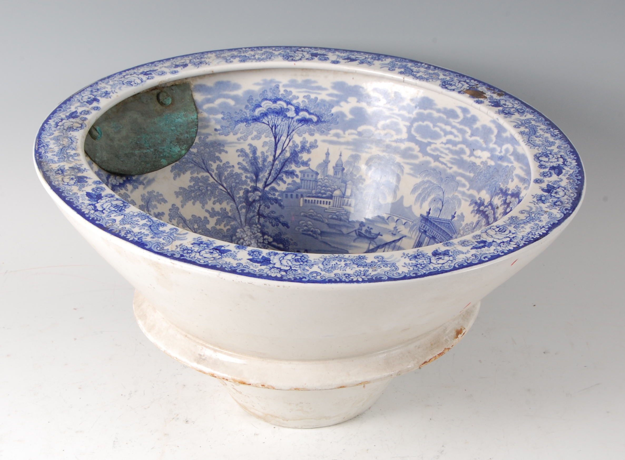 A Victorian blue and white transfer printed toilet bowl, the interior decorated with a fine