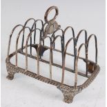 A George III silver six division toast rack, having central loop handle with disc below engraved