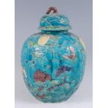 A 19th century Chinese ginger jar and cover, the turquoise ground applied with trailing flowers,