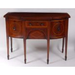 A George III mahogany bow and break-front sideboard, of small proportions, the top with satinwood