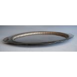 An Edwardian silver twin handled drinks tray, of oval form with raised reeded rim, 54oz, maker