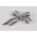 An early 20th century white metal sapphire and diamond bow brooch, the brooch comprising 51 old
