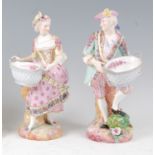 A pair of late 19th century French Vion & Baury porcelain figures, modelled as a maiden and