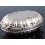 A late 19th century Hanau silver pocket snuff box, of hinged oval form, with clamshell decoration,