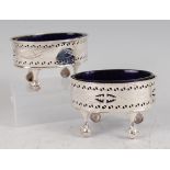 A pair of George III silver salts, each of pierced oval form and with bright cut decoration,