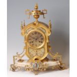 A French gilt bronze and champleve enamel mantel clock, circa 1870, the whole surmounted with a