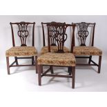 A good set of four early George III mahogany dining chairs, in the Chippendale taste, having