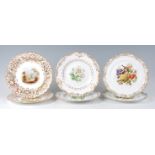 A pair of 19th century Coalport porcelain cabinet plates, each polychrome decorated with a cottage
