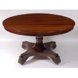A late Regency rosewood circular snap-top breakfast table, raised on an octagonal section flaring