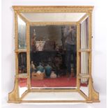 A 19th century giltwood and gesso overmantel mirror, having a centre bevelled plate within a