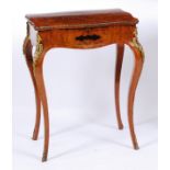 A Victorian figured walnut and marquetry inlaid needlework table, in the French taste, having gilt