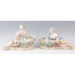 A pair of late 19th century Dresden porcelain basket figures, modelled as a reclining gallant and