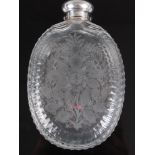 A George V cut glass and white metal mounted hip flask, the body of oval shape, acid etched with