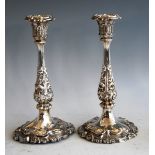 A pair of early Victorian silver candlesticks, in the mid-18th century style, each having detachable