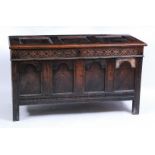 A circa 1700 joined oak coffer, having three panel hinged cover on original steel loop hinges, above
