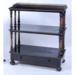 A Victorian ebonised and parcel gilt decorated three-tier whatnot by Gillow & Co, having pierced