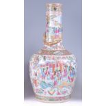 A 19th century Chinese Canton bottle vase, enamel decorated with opposing reserves of ceremonial