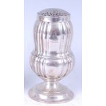 A circa 1900 continental white metal muffinier, of acorn shape, having a pierced cover and fluted