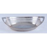 An early 20th century American sterling silver bowl, of pierced elliptical form and with a beaded