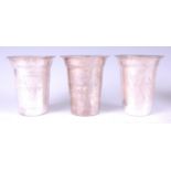 A set of three Indian silver goblets, each having flaring rims and simple stencil decoration, C20th,