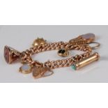 A 9ct gold curblink bracelet, containing a Georgian fob seal, bloodstone and agate set swivel fob,