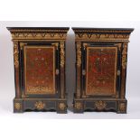 A pair of 19th century ebony and tortoiseshell boulle work inlaid side cabinets, each having a black