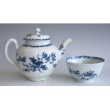 A Worcester porcelain feather moulded teapot and cover and matching tea bowl, circa 1756-60, painted