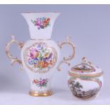 A 19th century Meissen porcelain twin handled vase, decorated in bright enamels with floral sprays
