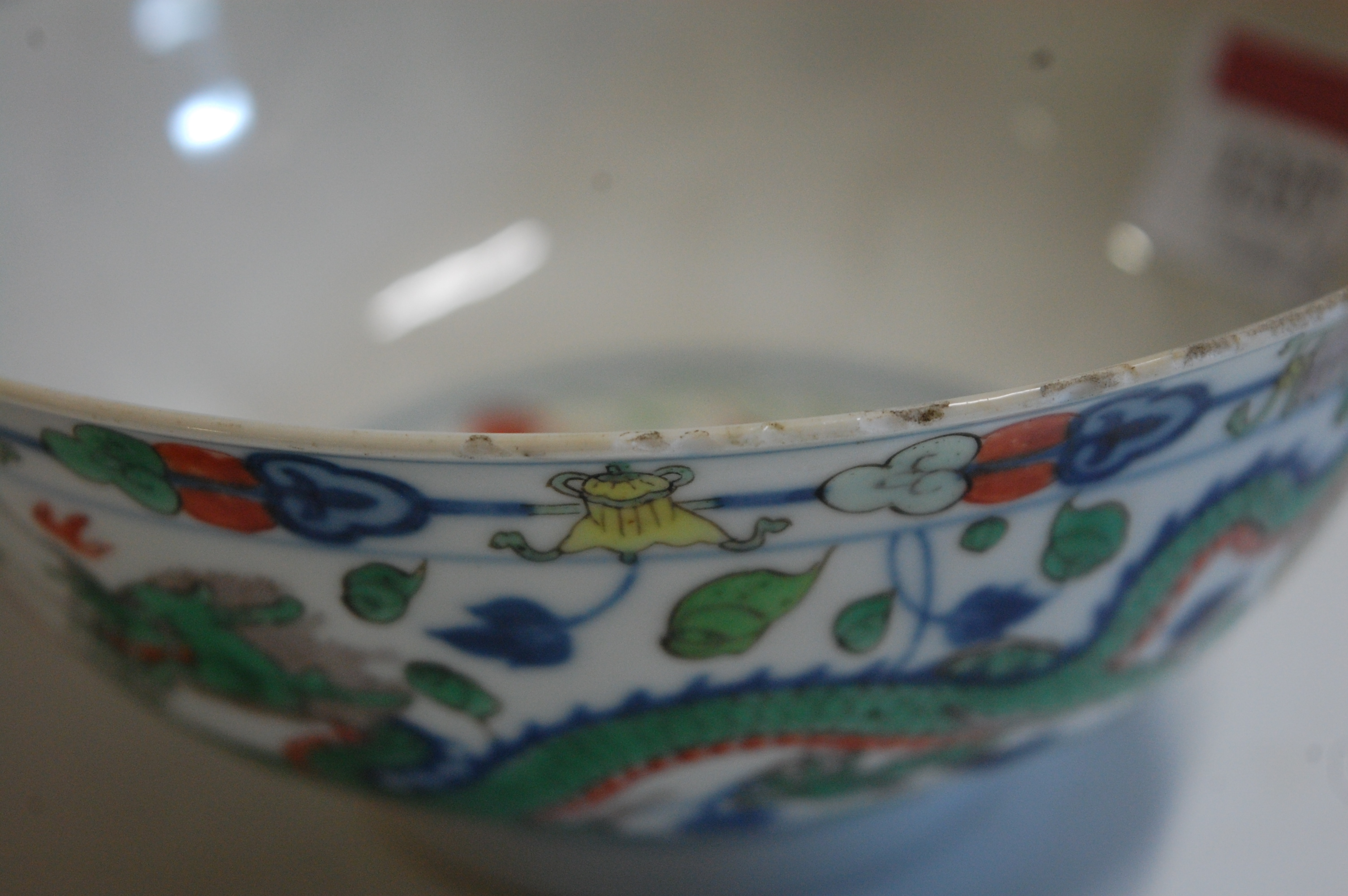 A Chinese porcelain bowl , the interior blue and white decorated with flowering rockwork and - Image 7 of 37