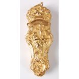 A George III gilt metal etui, worked in high relief with female figures to either side, within