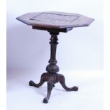A Victorian figured walnut tripod games table, the octagonal top inset with marquetry backgammon and