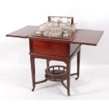 An Edwardian mahogany 'surprise' table, of square section, the top opening to reveal fitted interior