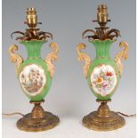 A pair of 19th century porcelain (possibly Rockingham) and gilt bronze mounted vases, having