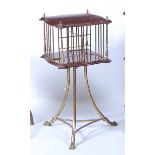 A brass and walnut revolving bookstand, of small proportions and of shaped square section, 20th