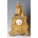 A mid-19th century gilt bronze mantel clock, the case surmounted with water-girl in full dress, over